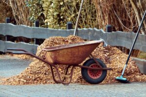 wheelbarrow with mulch and tools